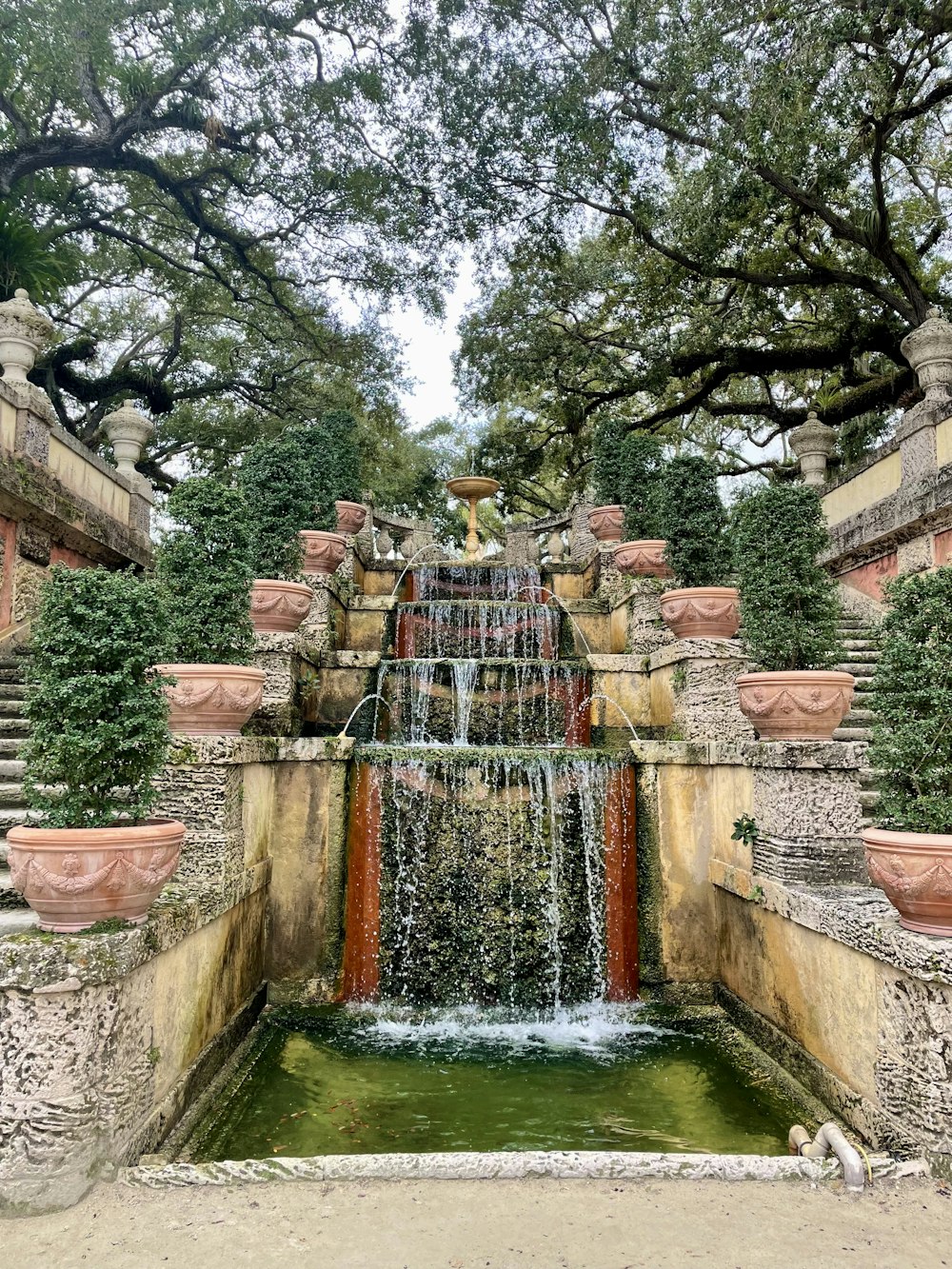 a water fall in the middle of a garden