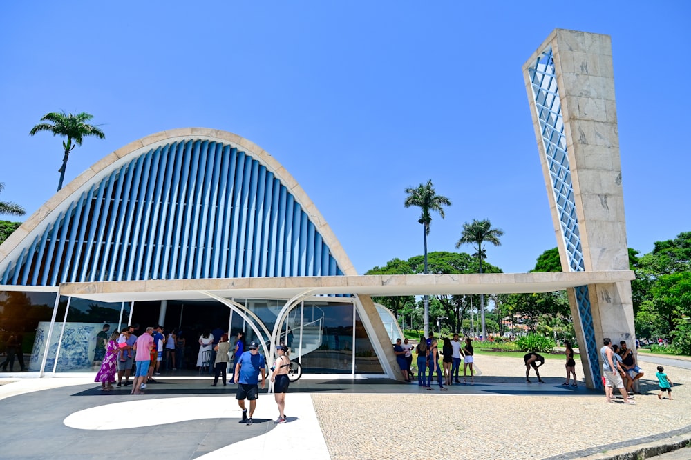 a group of people standing in front of a building