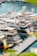 A marina filled with luxury yachts docked along the pier. The water is a clear blue and the scene is framed by vibrant green foliage. The yachts are sleek, with modern designs, and display various national flags.