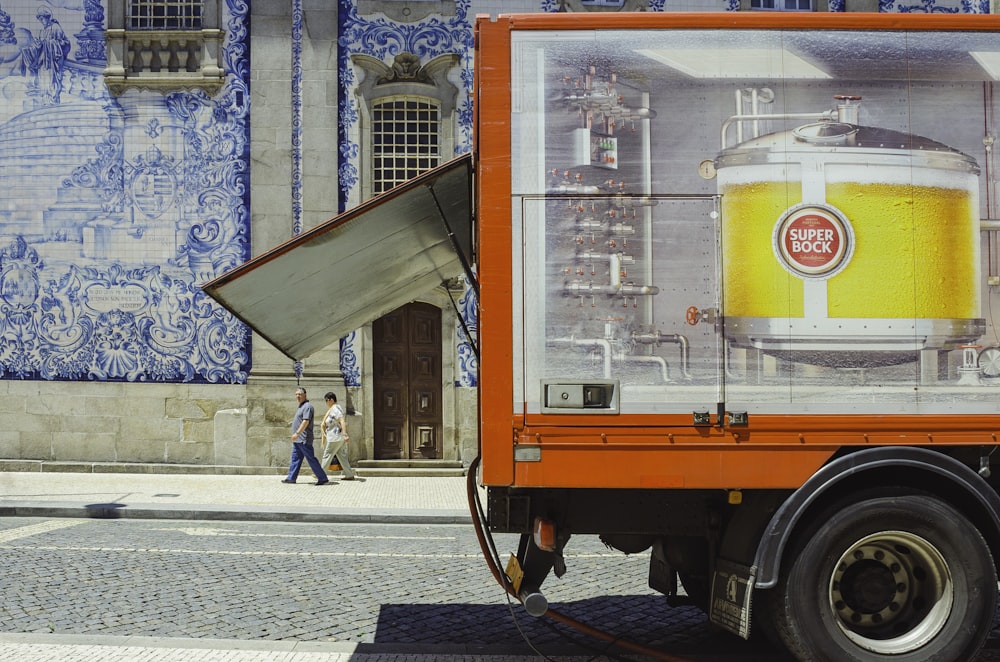 a truck with a beer advertisement on the side of it