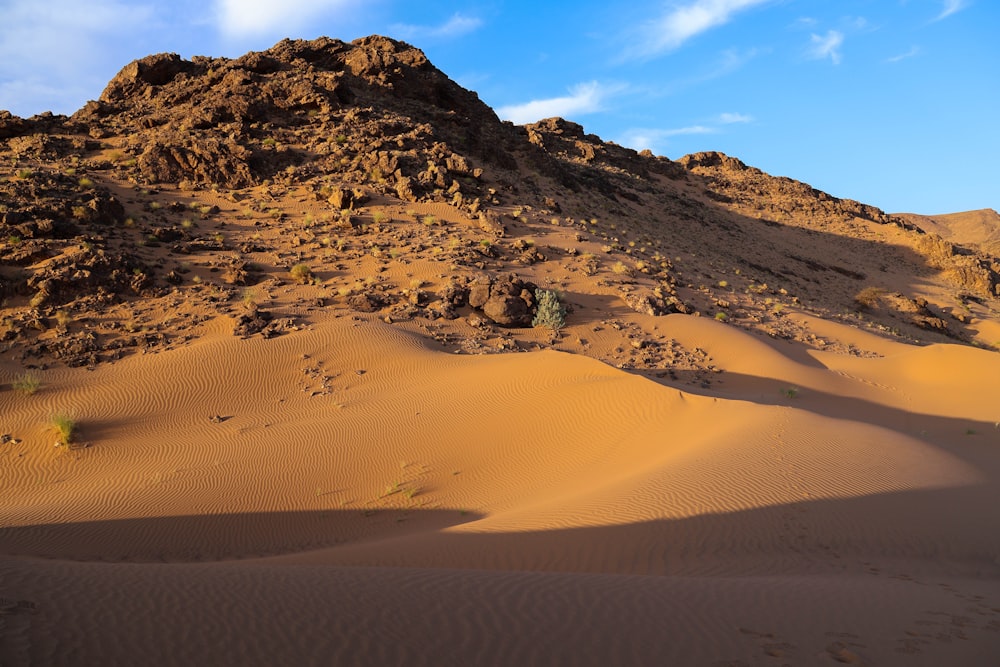 a mountain in the middle of a desert