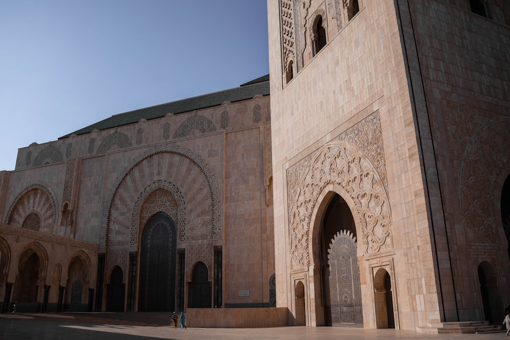 a person standing in front of a large building