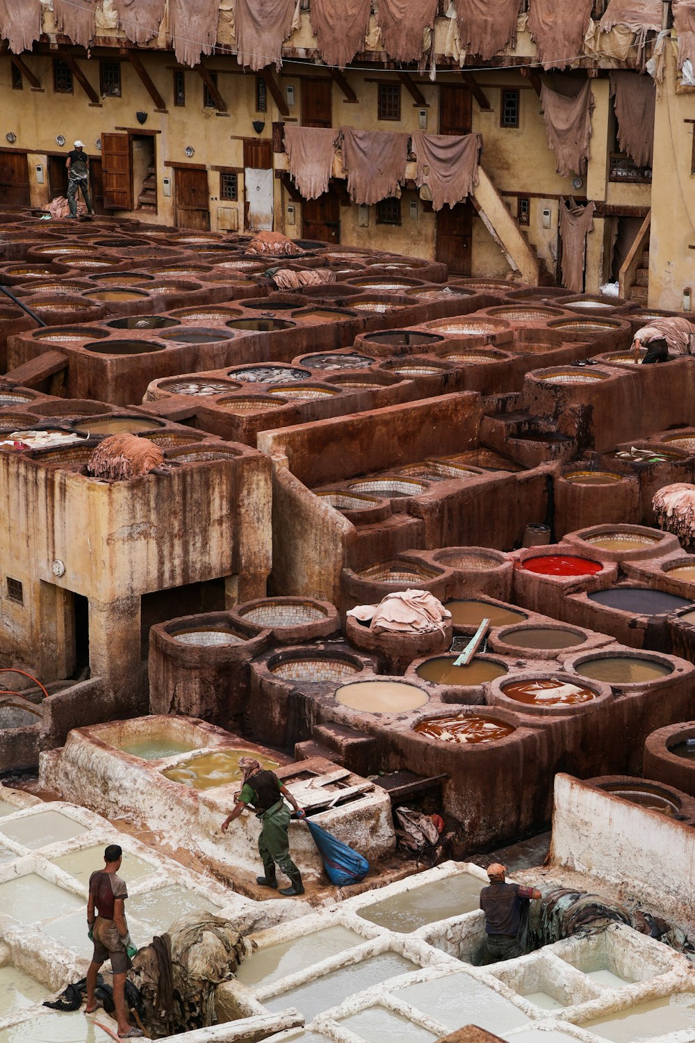 a group of people working in a factory yard