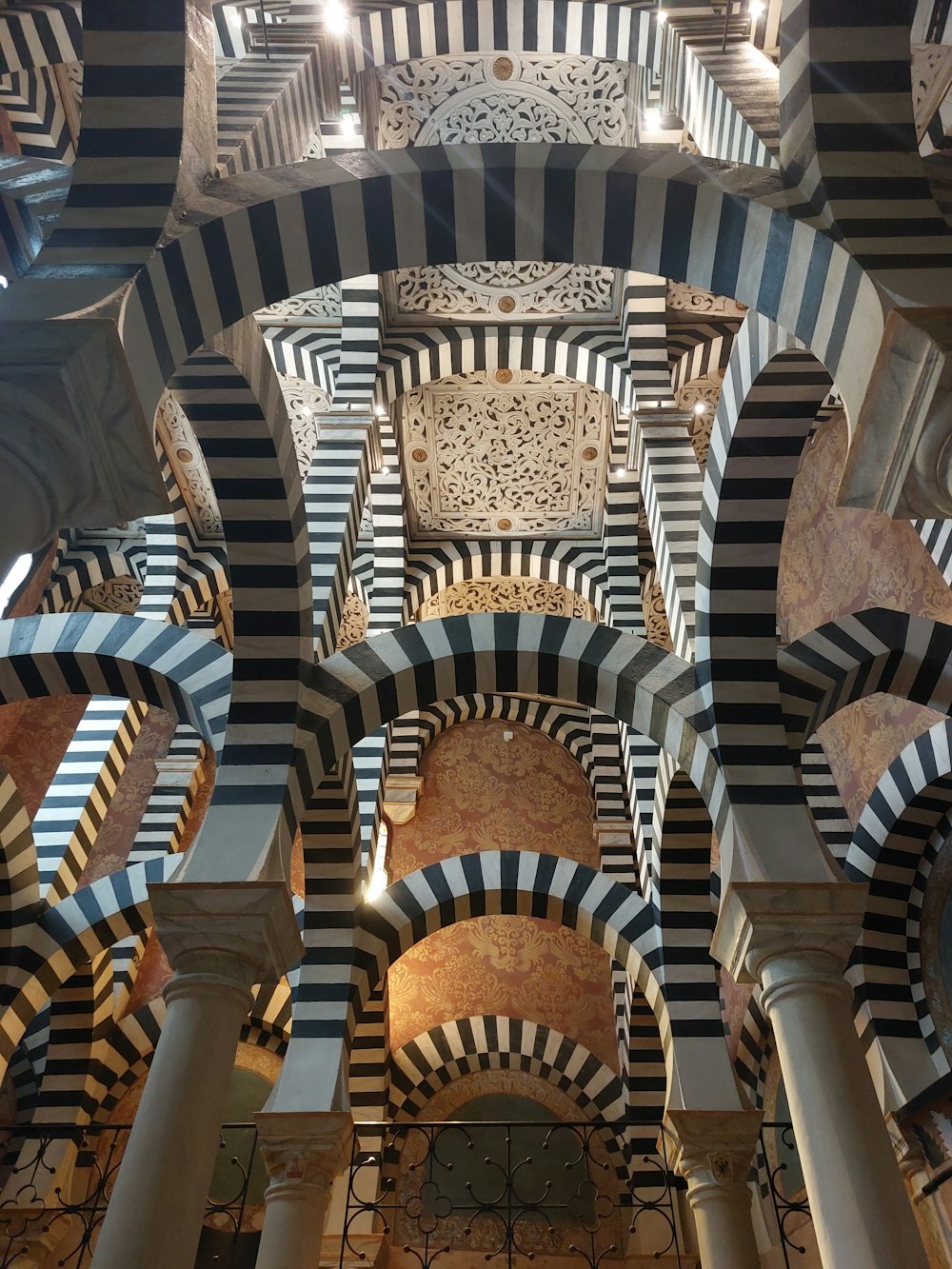 the ceiling of a building with black and white stripes
