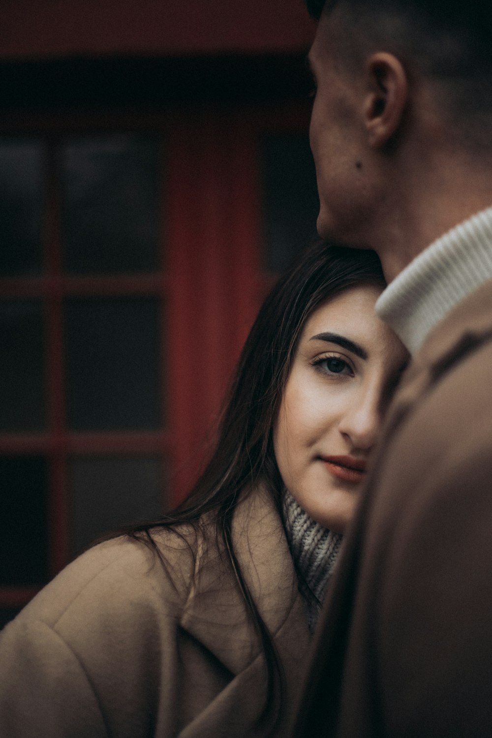 a close up of a person wearing a coat