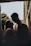 A softly lit, intimate portrait of a couple sharing a quiet moment outdoors at golden hour.