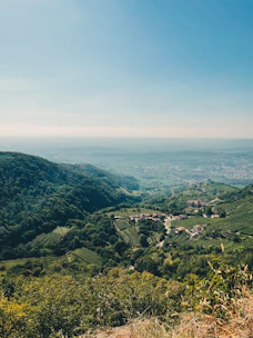 A scenic view of a green parcel of land in Codegua with rolling hills and clear skies.
