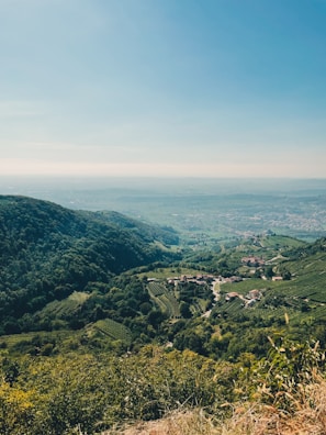 Scenic valley view with chirimoya orchards and distant mountains near Santa Rosa de Quivez.