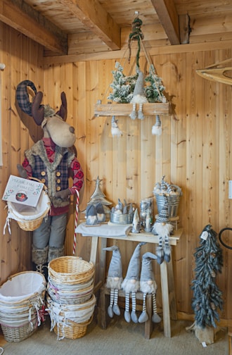 A cozy living room decorated with classic reindeer figurines and warm string lights.