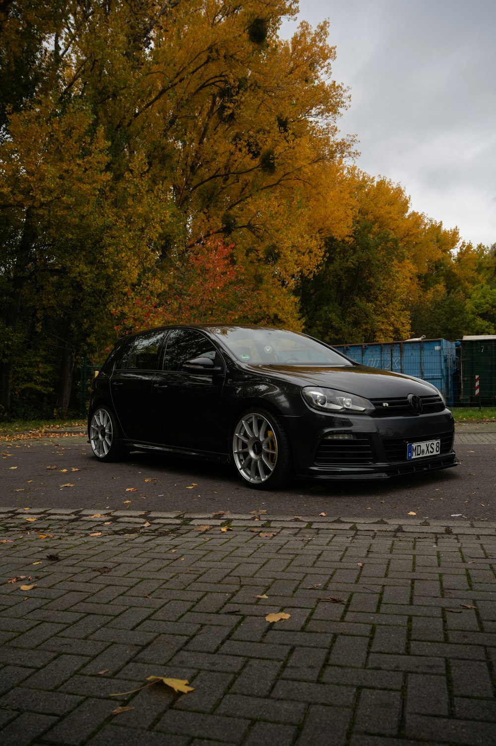 a black car parked on the side of the road