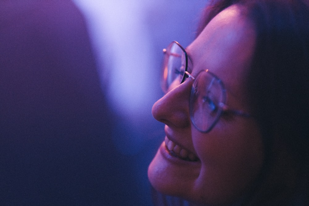 a close up of a person wearing glasses