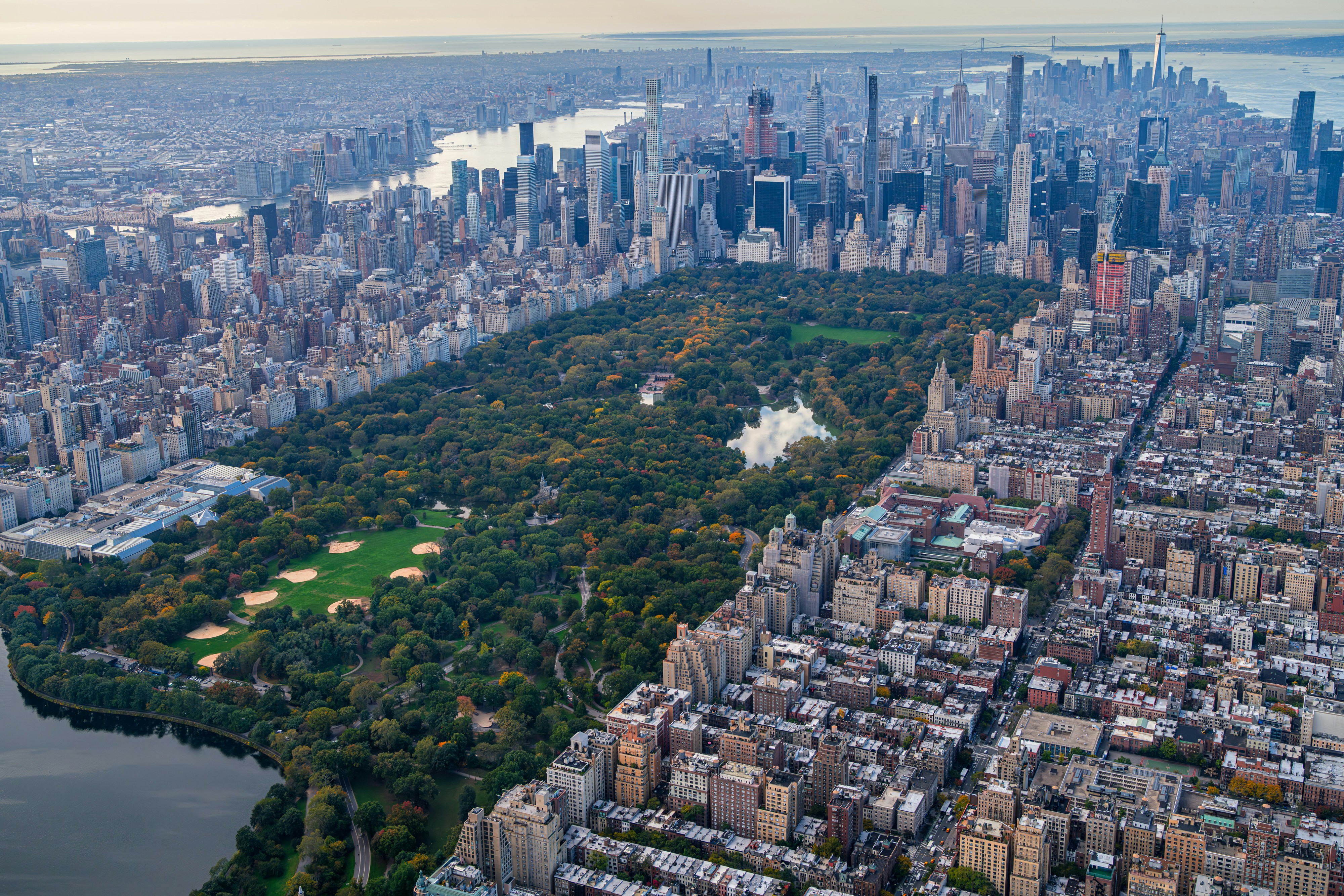 an aerial view of a city and a lake