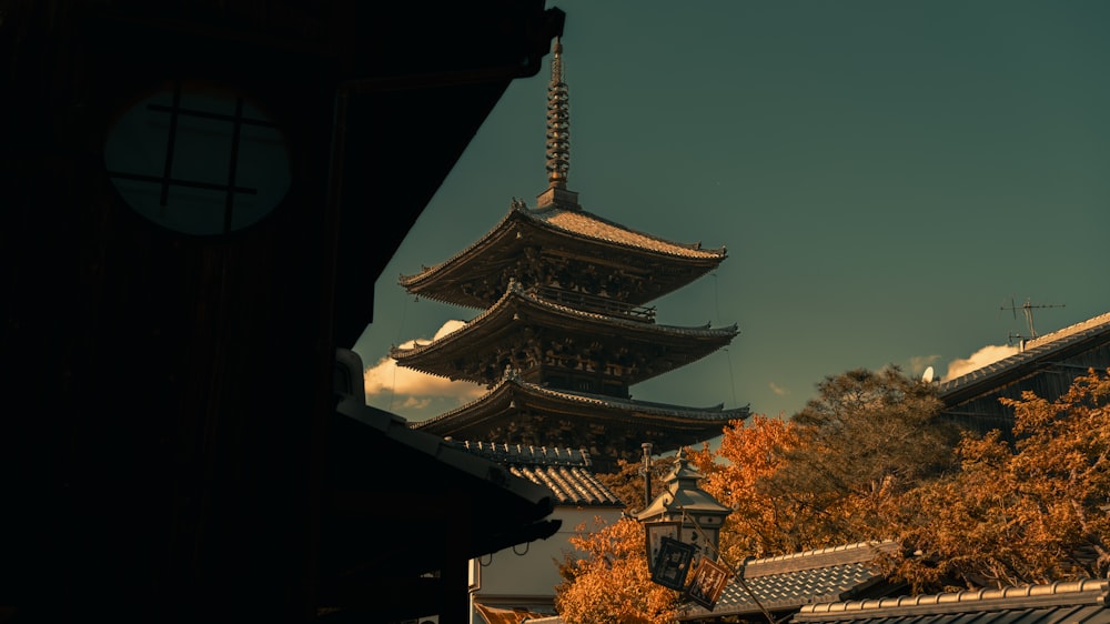 a tall building with a tower in the background