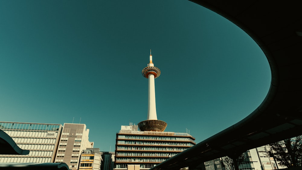 a view of a very tall building in the middle of a city