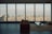 A modern living room with elegant furniture and large windows showcasing a beautiful view.