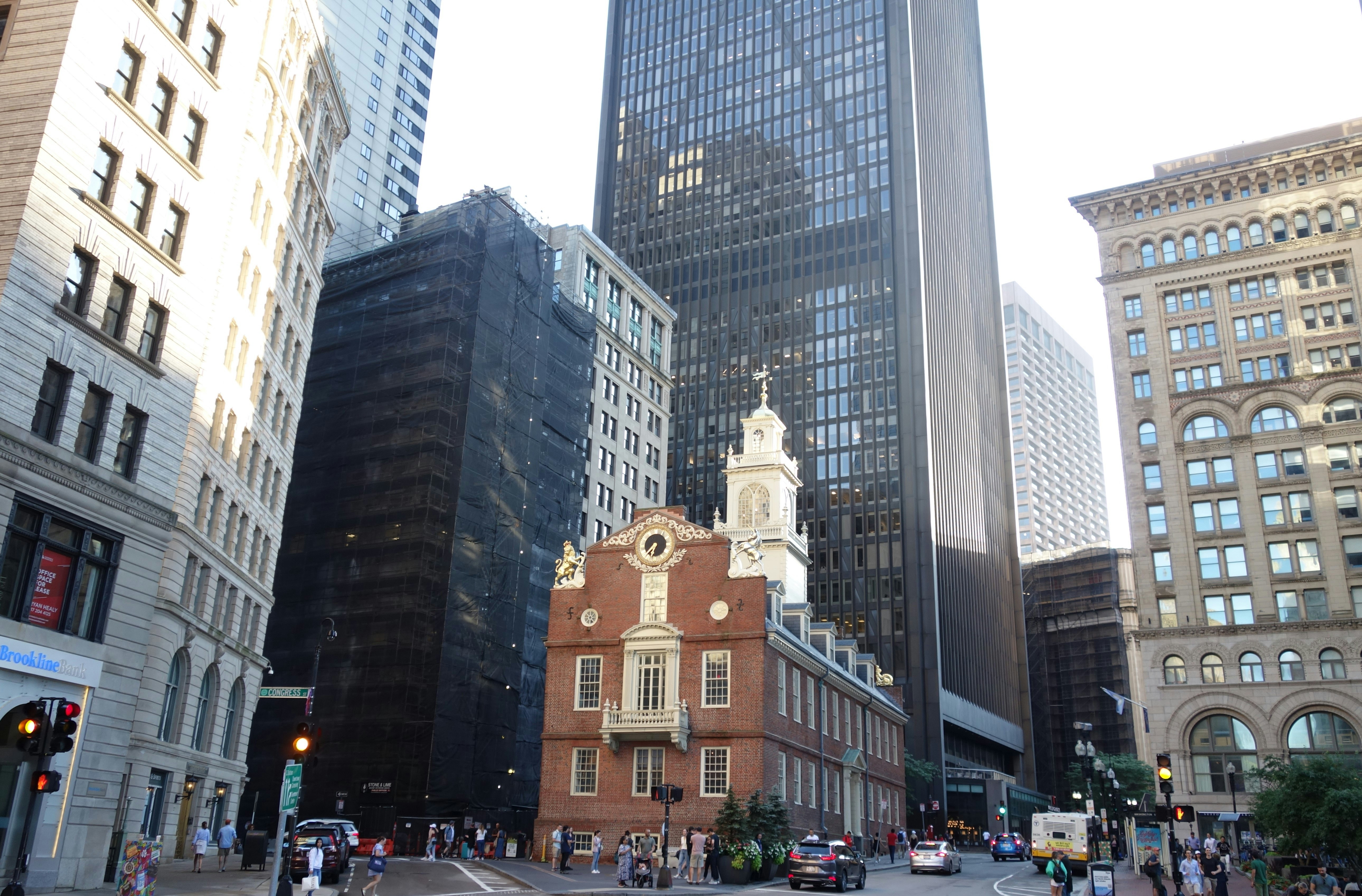 a city street filled with lots of tall buildings