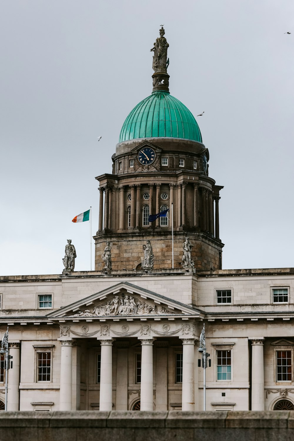 a large building with a green dome on top