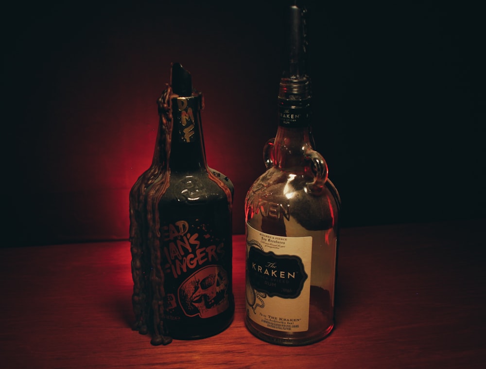 a couple of bottles sitting on top of a wooden table