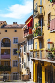 A vibrant family enjoying a sunny day in a picturesque Spanish neighborhood.