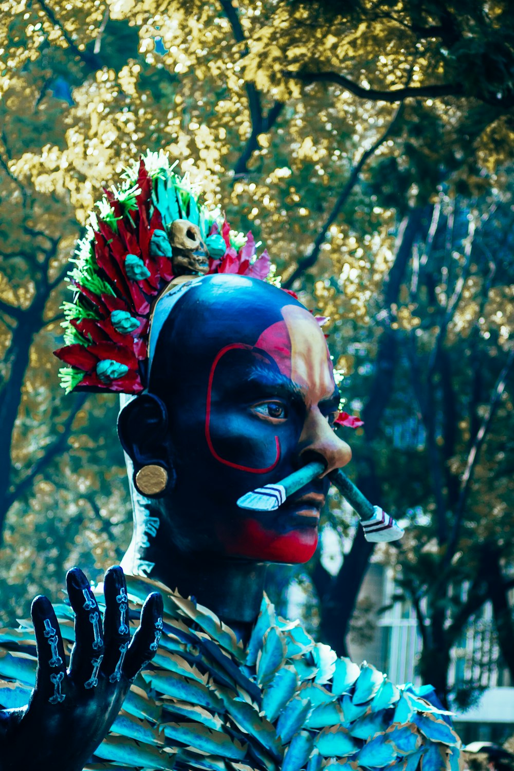 a man with a painted face smoking a cigarette