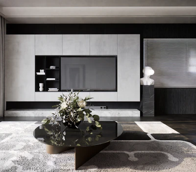 a black and white living room with a large tv