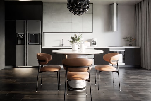 A sleek, modern custom kitchen set with wood and black accents in a bright, elegant interior.
