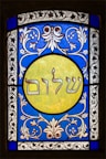 a stained glass window with a picture of a man on it