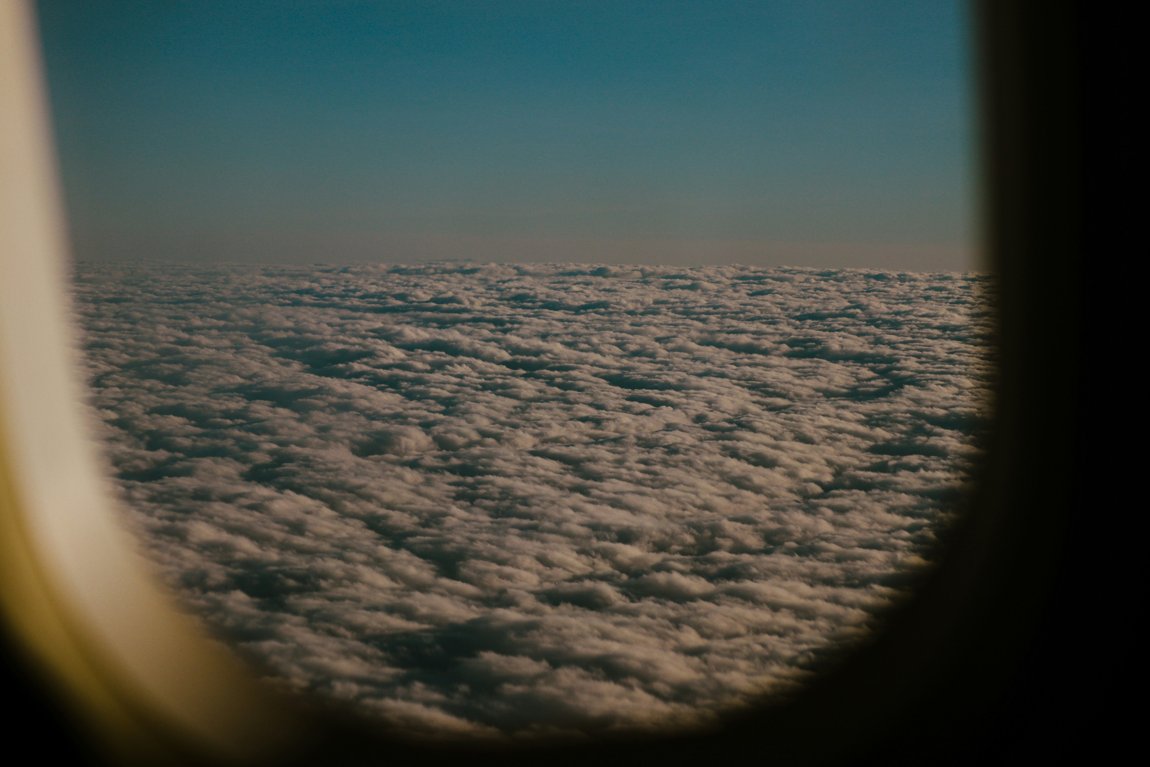 a view of the clouds from an airplane window
