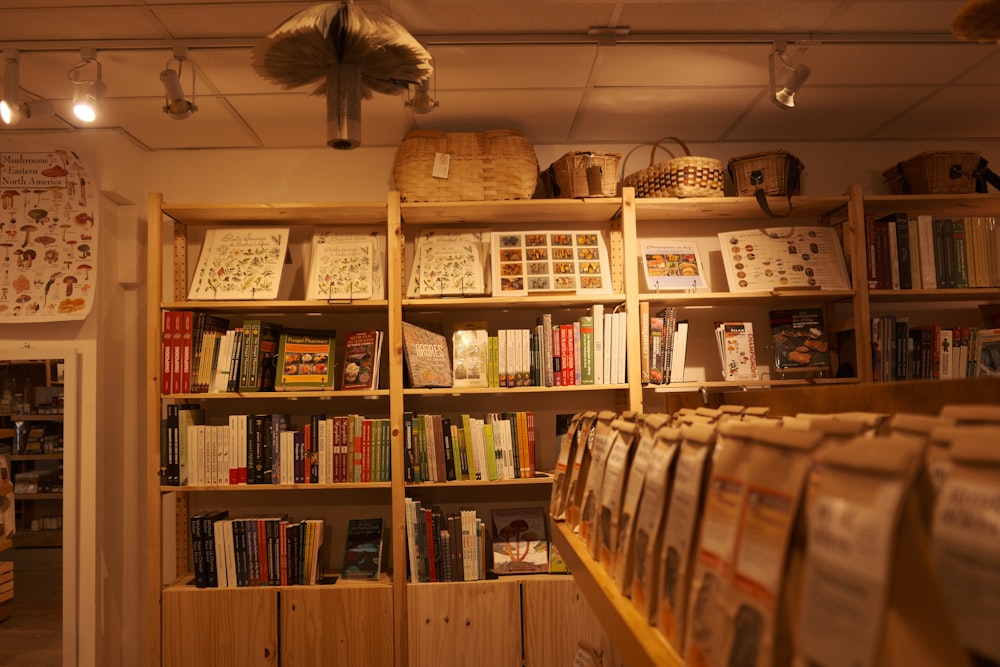 a bookshelf filled with lots of books in a room