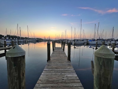 A calm marina at sunset with boats moored safely, symbolizing smart decision-making.