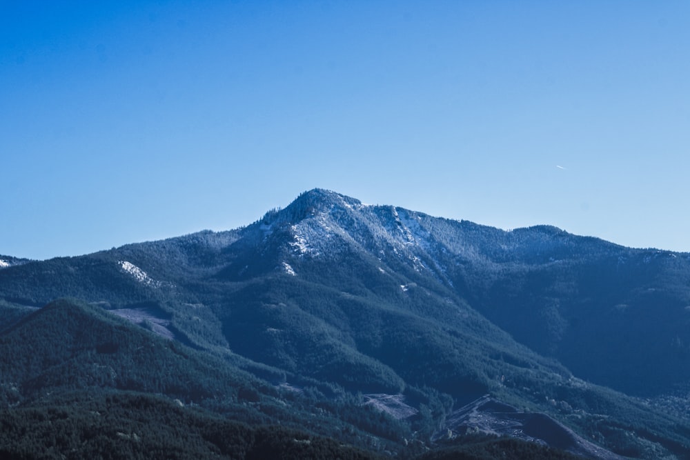 a view of a mountain range with snow on the top