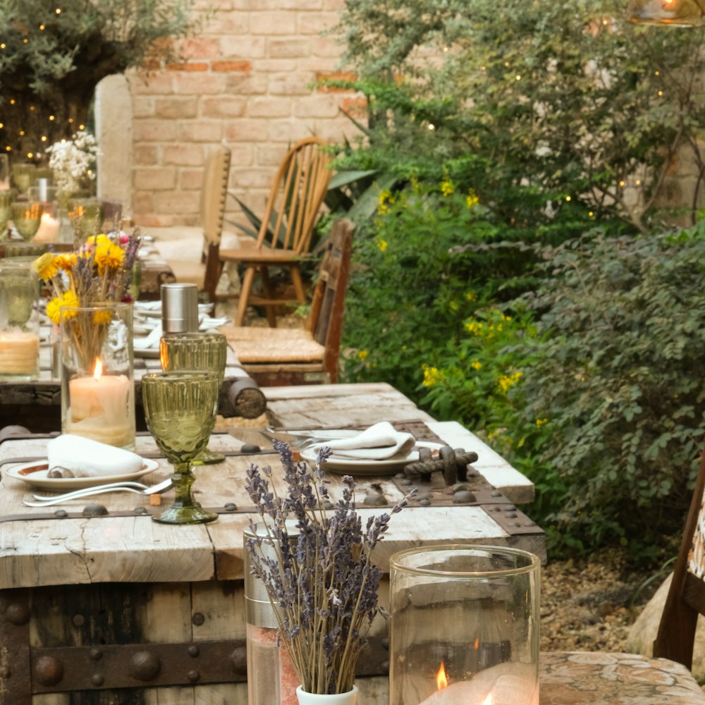 a wooden table topped with a vase filled with flowers