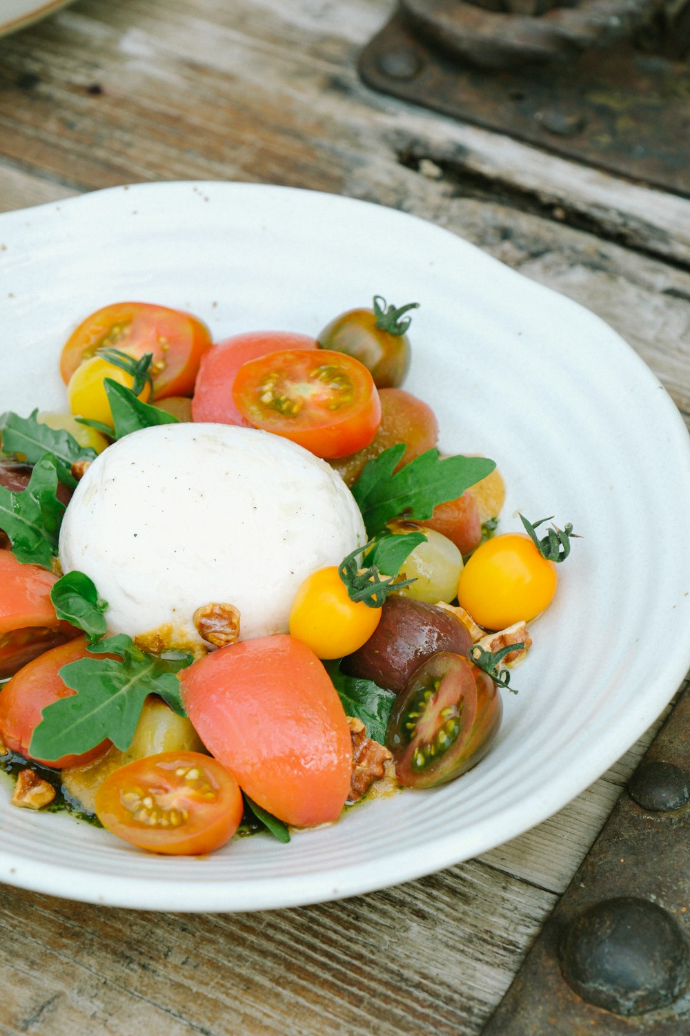 a white bowl filled with lots of different types of food