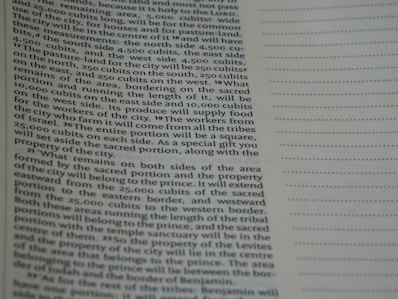A close-up view of a page from a book containing printed text. The text is structured in paragraphs and discusses measurements, locations, and property designations. On the right side, there is a column with evenly spaced, horizontal, dotted lines.