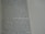 A close-up view of a page from a book containing printed text. The text is structured in paragraphs and discusses measurements, locations, and property designations. On the right side, there is a column with evenly spaced, horizontal, dotted lines.