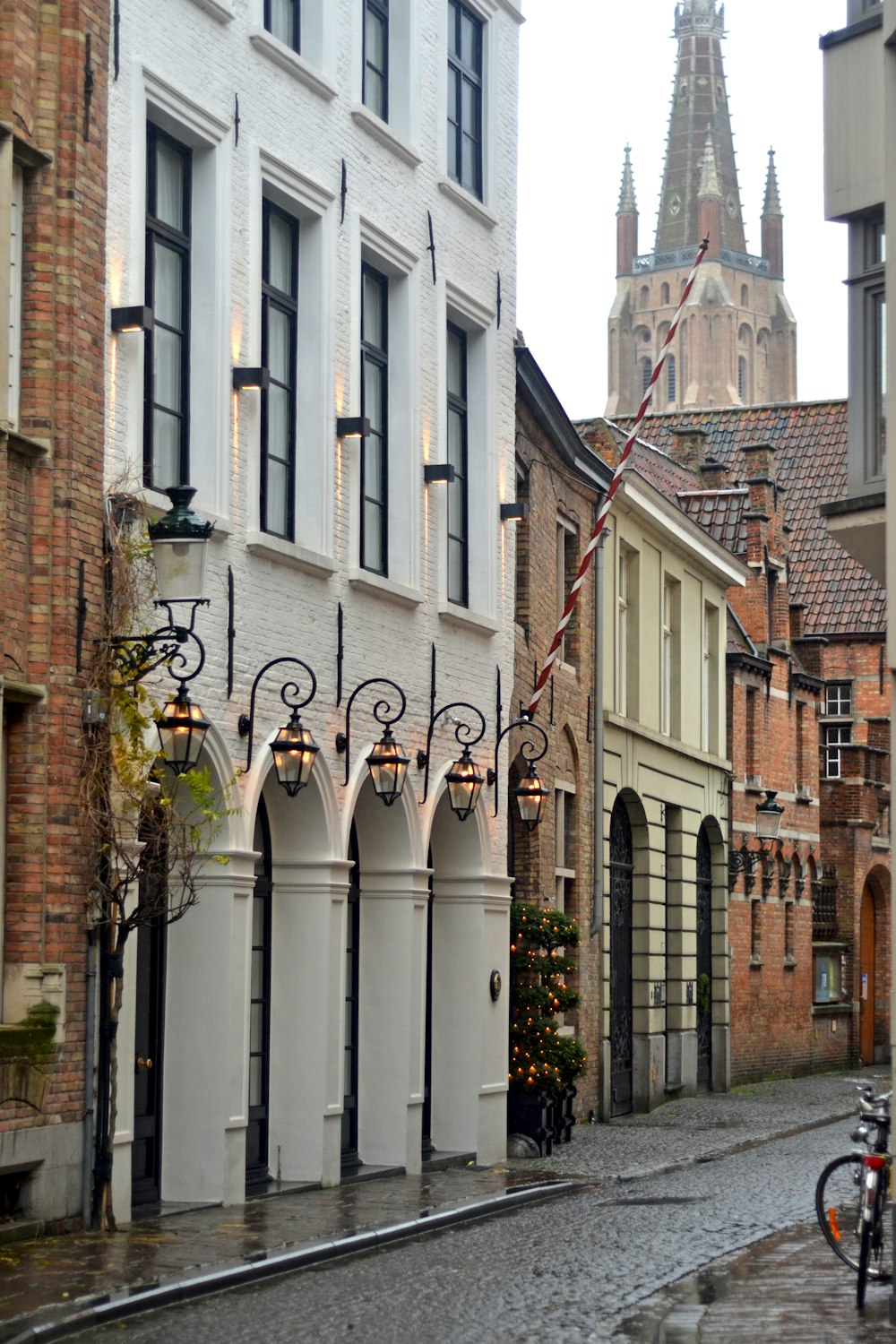 a cobblestone street lined with tall buildings