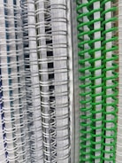 Close-up of neat stacks of notebooks with different covers in black, white, and yellow colors.