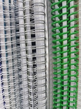 A vibrant stack of freshly printed and bound notebooks ready for delivery.