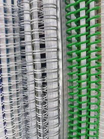 A stack of neatly organized notebooks with colorful tabs marking key topics.