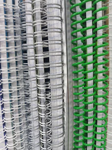 Stacks of colorful school textbooks and notebooks arranged neatly.
