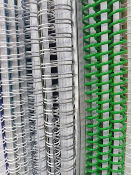 Stacked notebooks with textured covers and crisp, clean pages ready for notes.