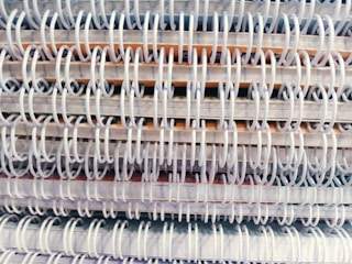 Close-up of a stack of premium notepads with embossed logos.