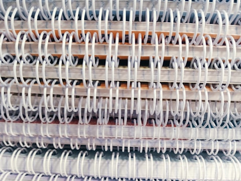 Close-up of a stack of premium notepads with embossed logos.