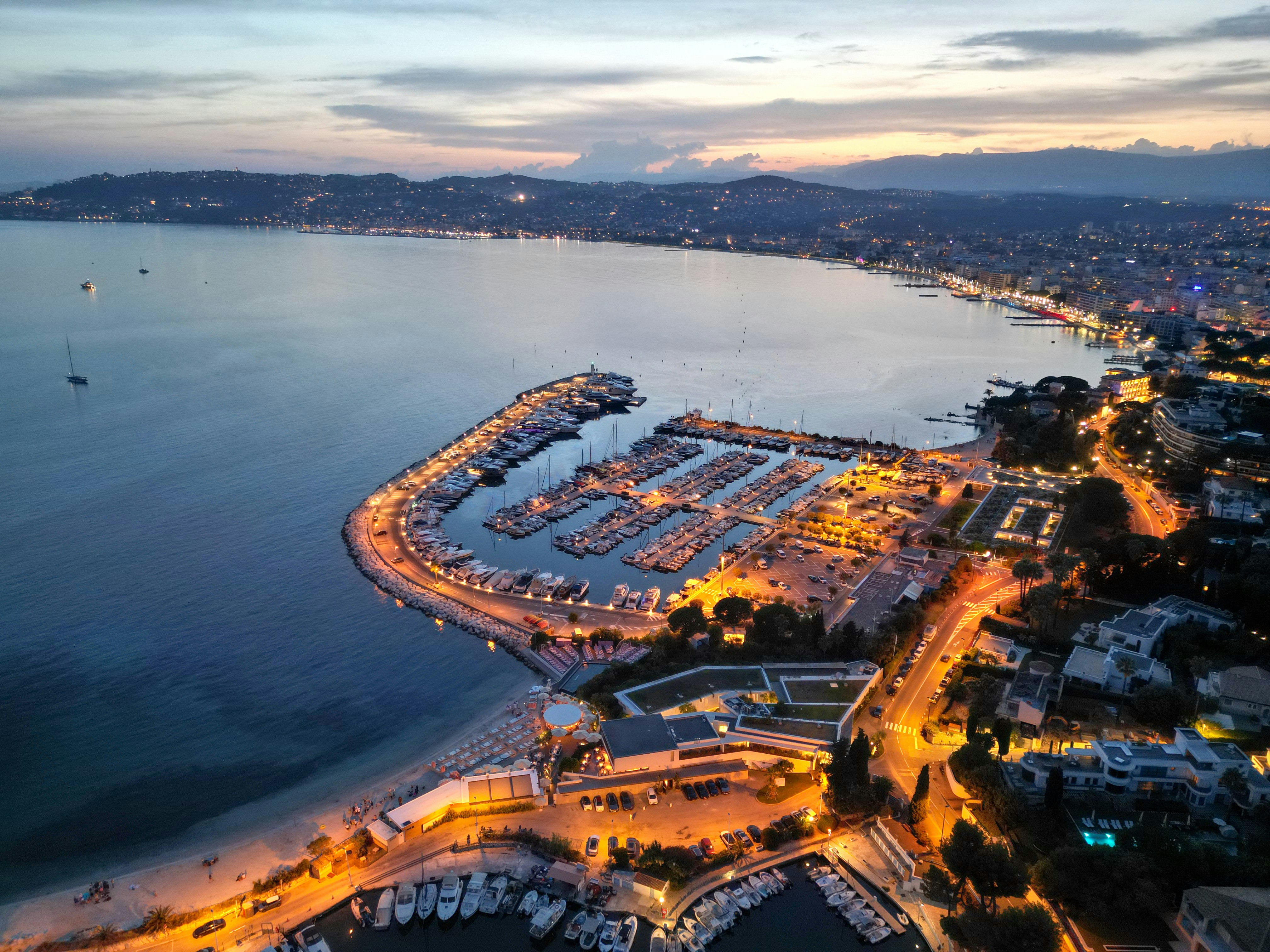 an aerial view of a marina at night