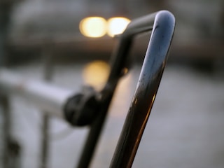 Close-up of a finely welded metal railing highlighting smooth finishes and craftsmanship.