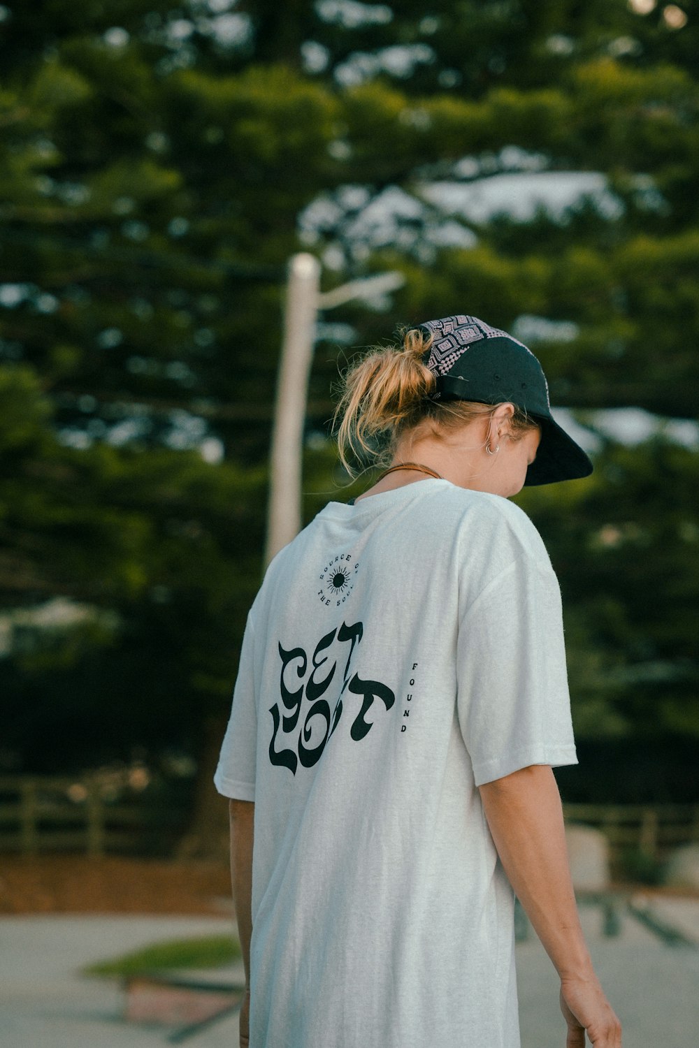 a woman with a skateboard in her hand