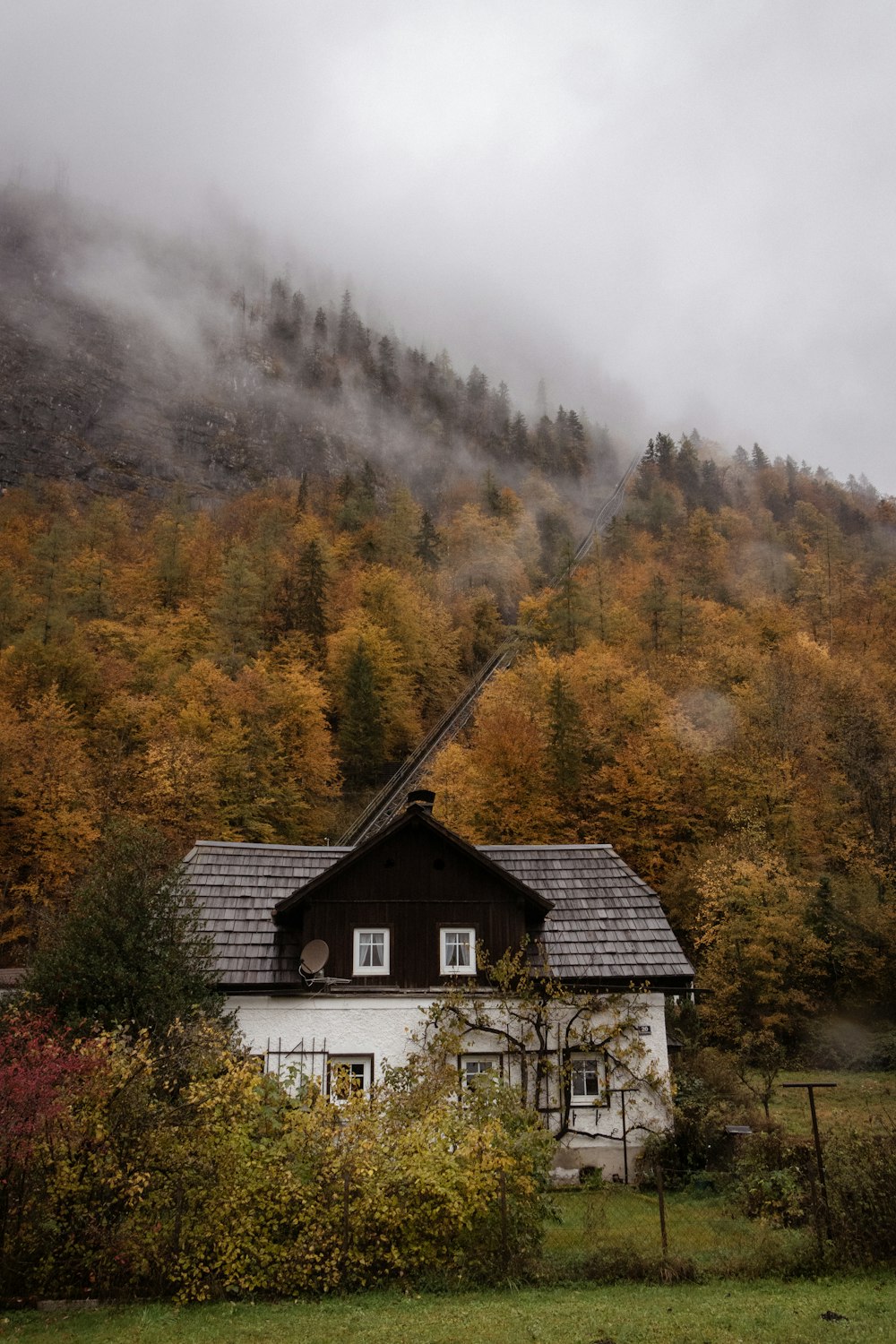 a house with a mountain in the background