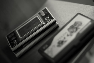 Close-up of vintage game cartridges and controllers from the early 2000s.