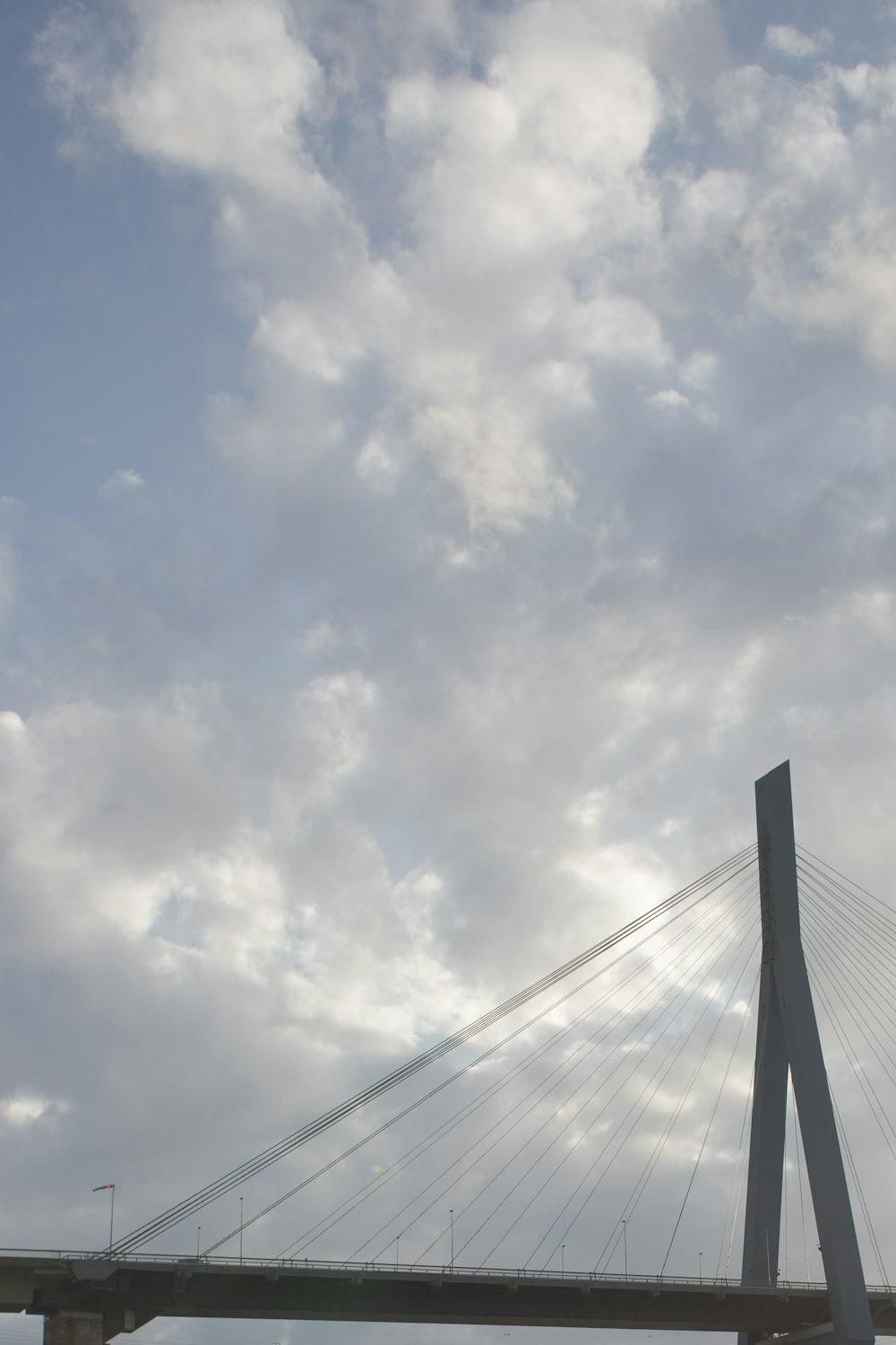 a very tall bridge with a very tall bridge in the background