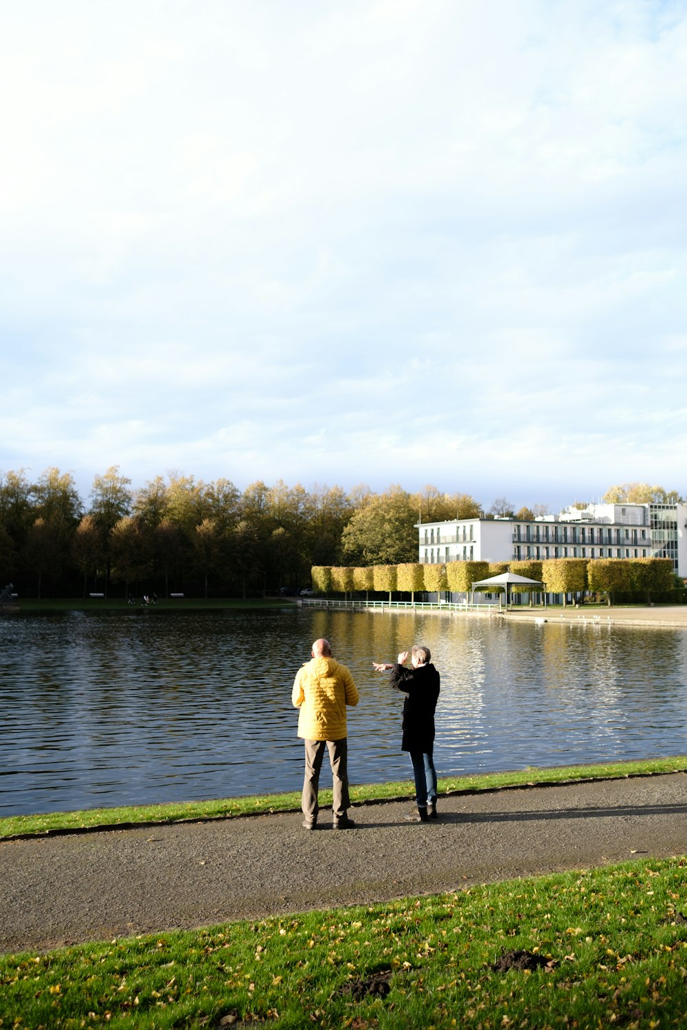 a couple of people that are flying a kite